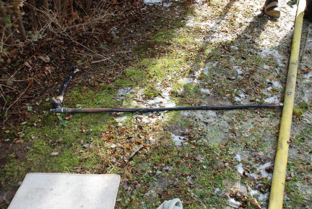 Gas pipe blown from its mounting by the force of the blast.