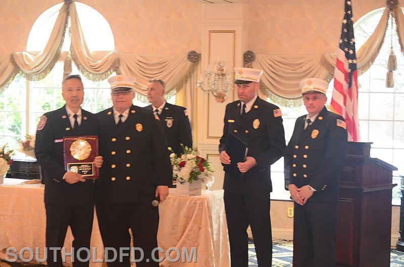 Fred Lee is presented with the EMT of the Year award.
