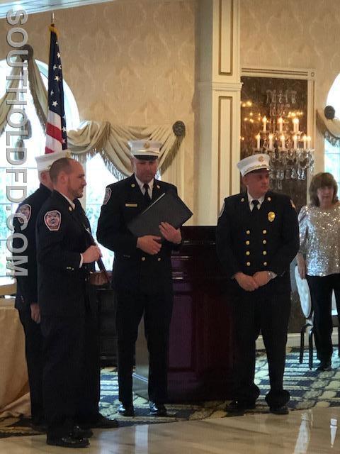 J.R. Rumpler receiving the Firefighter of the Year Award.