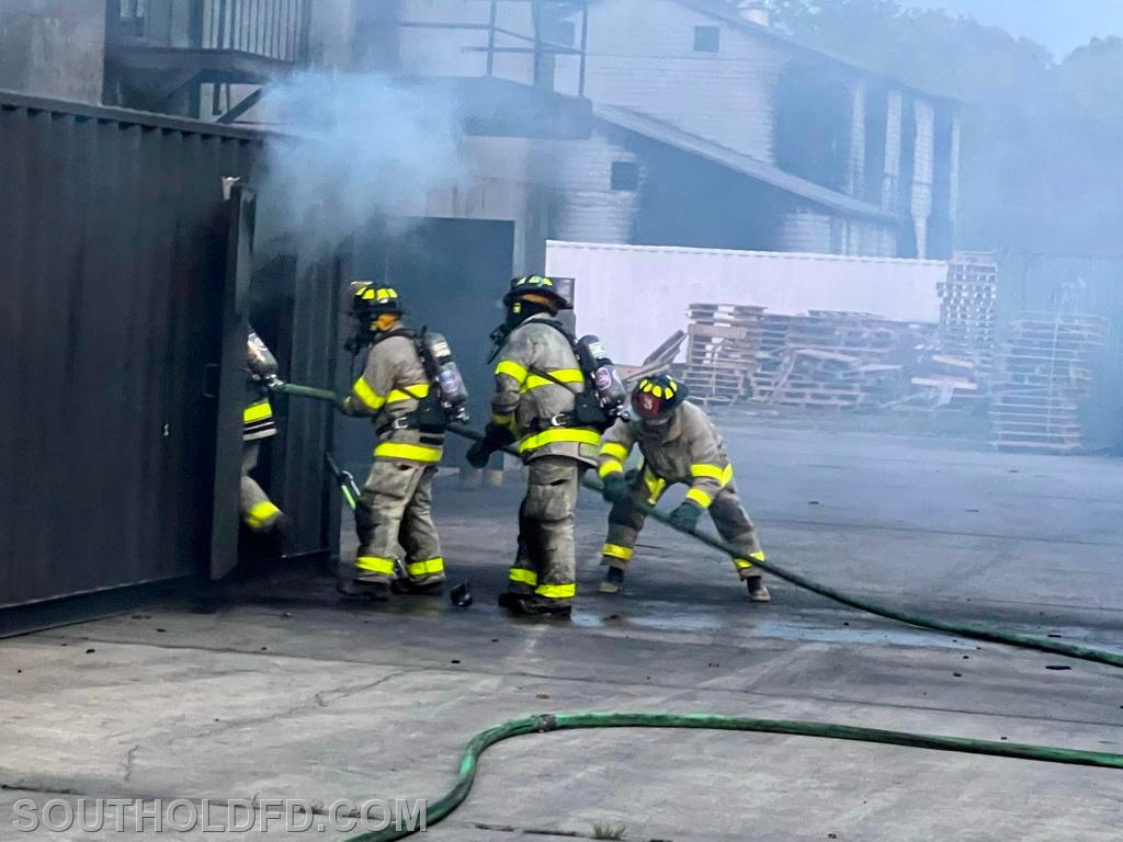 Attacking a storage container fire.