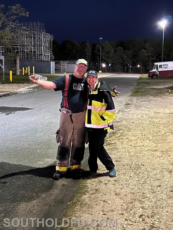 More teamwork. EMT Karen Byrnes managed the accountability when firefighters enter the buildings. Ex-Captain Steve 
Geehreng manned the pumps on 8-4-2, managed the hose and lifted everything heavy!