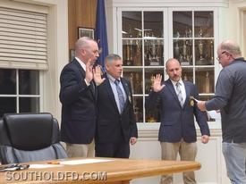 Deputy Chairman Brett Kehl (right) swears in Chief Engineer David Surozenski, 1st Asst. Chief Pindar Damianos and 2nd Asst. Chief John Rumpler IV.